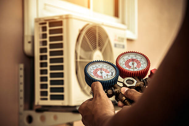 Professional Air Conditioning Service technician working in Marcy, NY